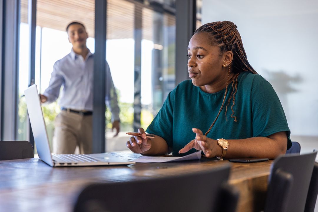 Diverse Coworkers Collaborating in Modern Work Environment