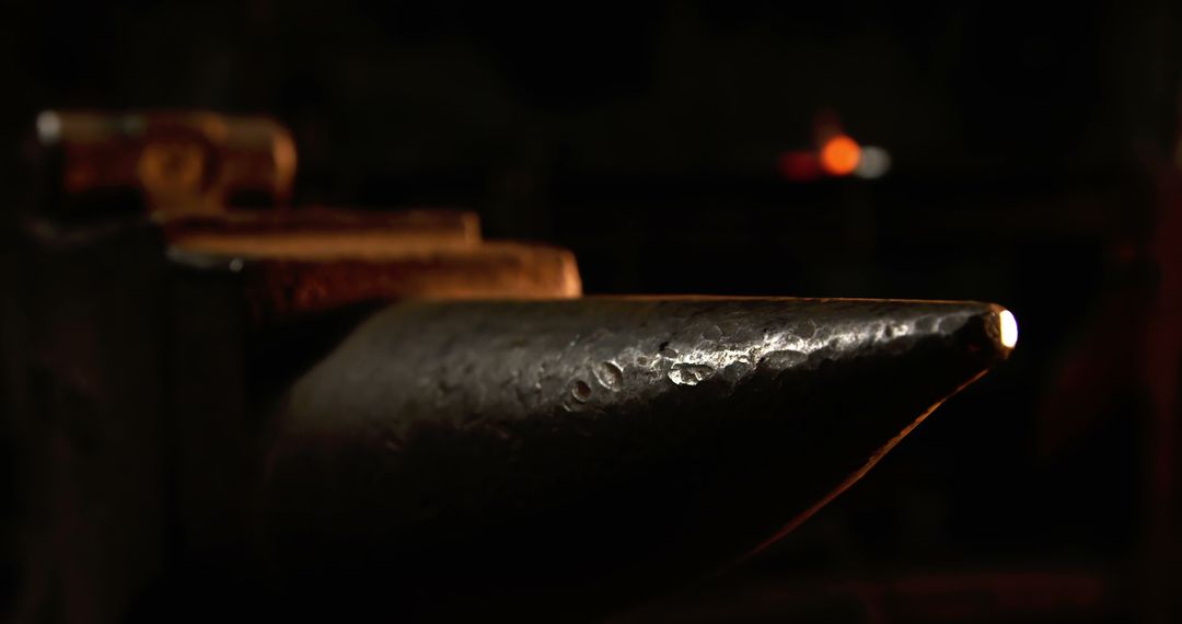 Close-Up of Anvil and Hammer in Rustic Workshop