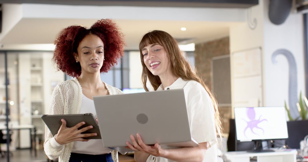 Diverse Coworkers Collaborating in Modern Open Office Space
