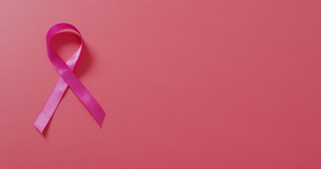 Image of pink breast cancer ribbon on dark pink background - Free Images, Stock Photos and Pictures on Pikwizard.com