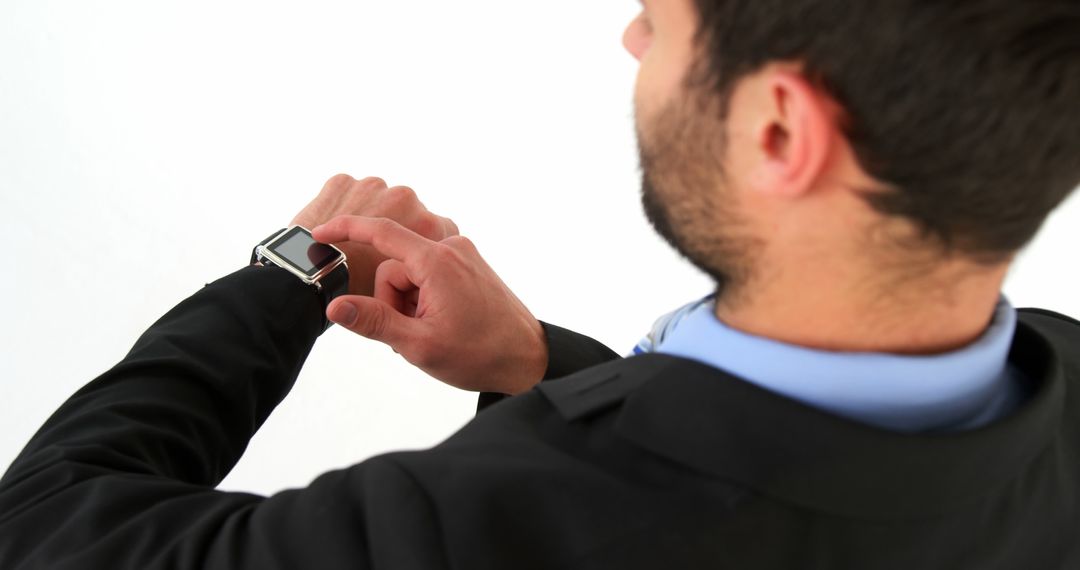 Businessman Using Smartwatch for Checking Notifications - Free Images, Stock Photos and Pictures on Pikwizard.com