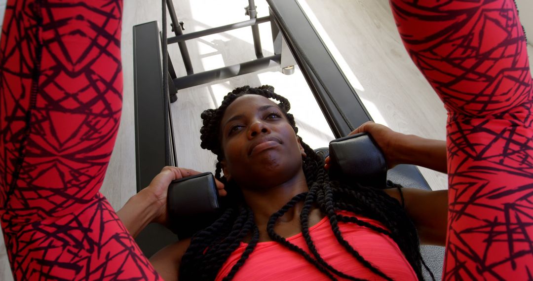 Determined Woman Working Out at Gym with Leg Press Machine - Free Images, Stock Photos and Pictures on Pikwizard.com