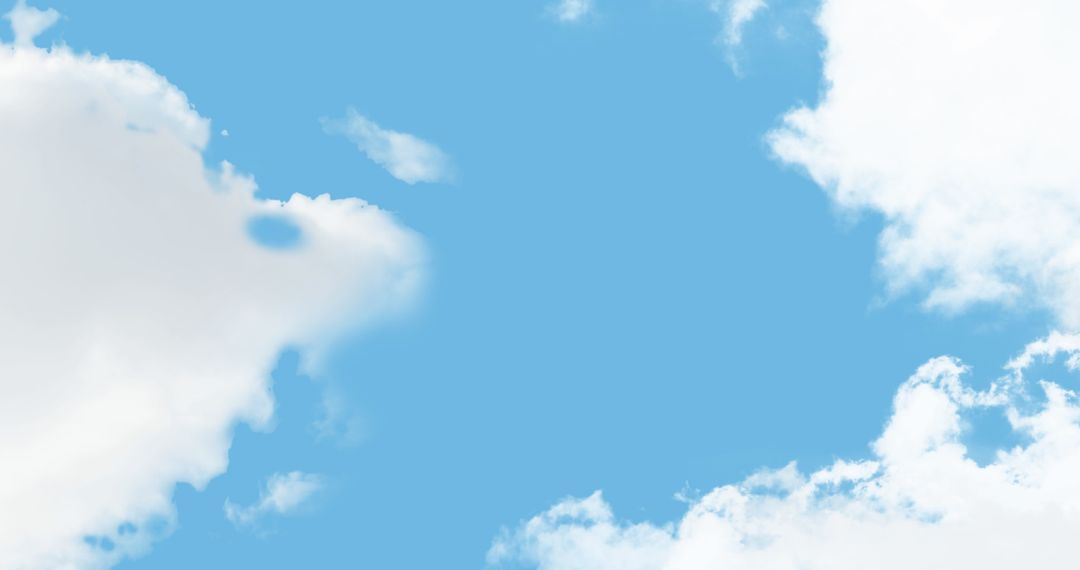 Tranquil Blue Sky with Fluffy White Clouds