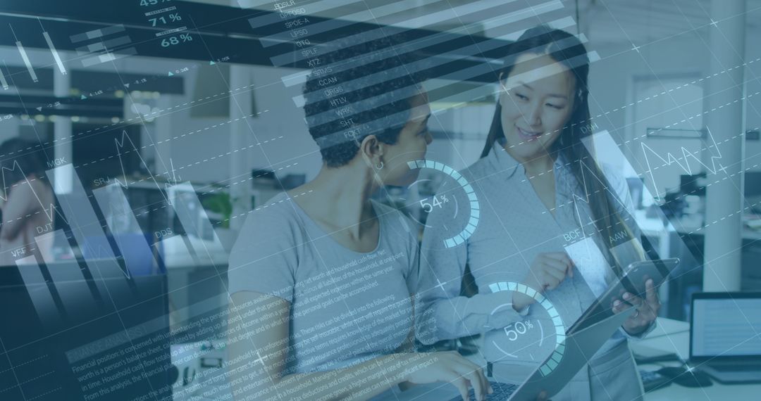 Business Professionals Analyzing Data on Tablet in Modern Office