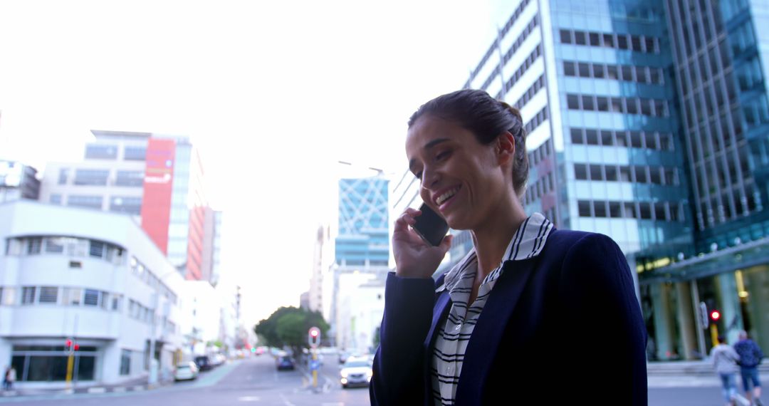 Confident Businesswoman Talking on Phone in Urban Cityscape - Free Images, Stock Photos and Pictures on Pikwizard.com