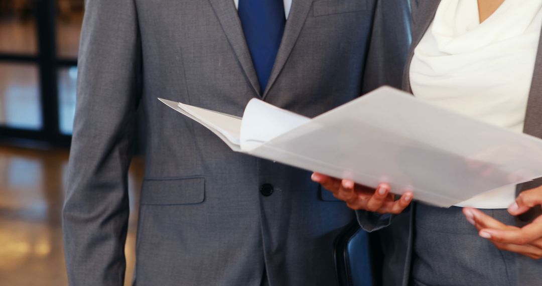 Co-Workers Collaborating on Business Document