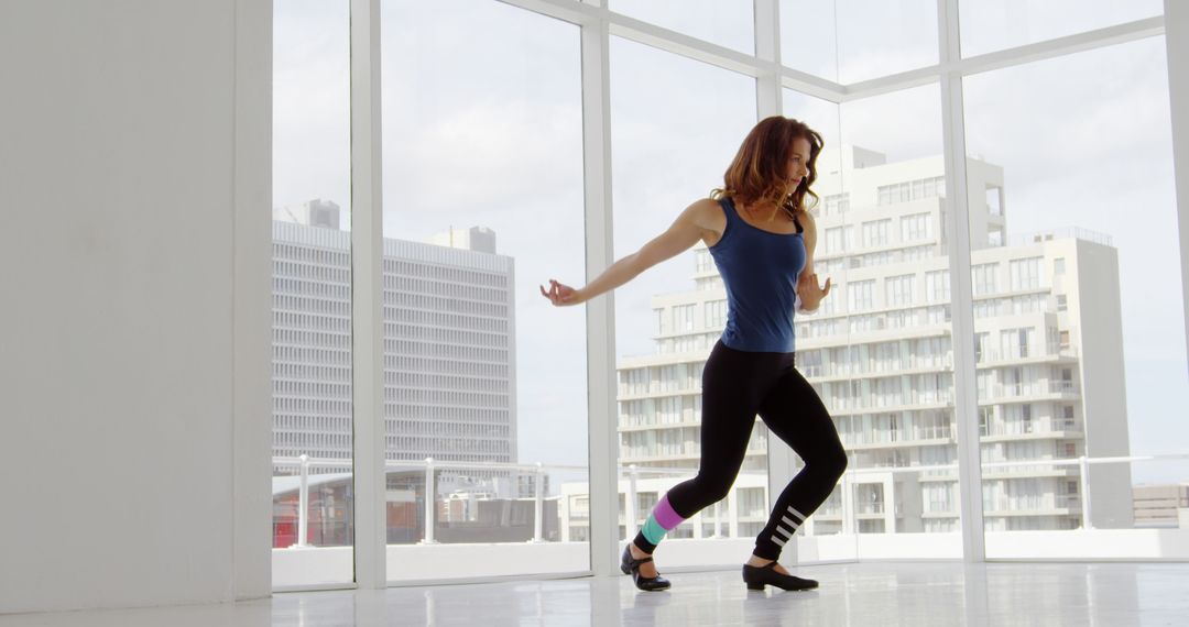 Woman Dancing Freely in Bright Modern Studio - Free Images, Stock Photos and Pictures on Pikwizard.com