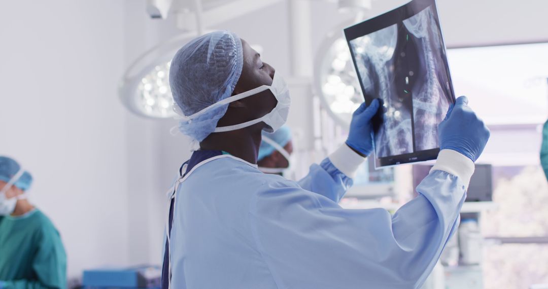 Surgeon Examining X-ray Scan in Operating Room - Free Images, Stock Photos and Pictures on Pikwizard.com