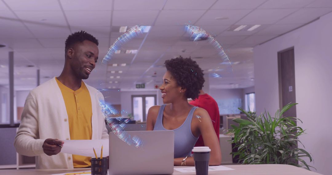 Coworkers Collaborating in a Modern Open Office Environment