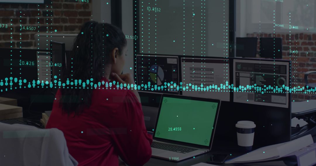 Businesswoman Analyzing Data with Overlaid Graphs on Laptop Screen