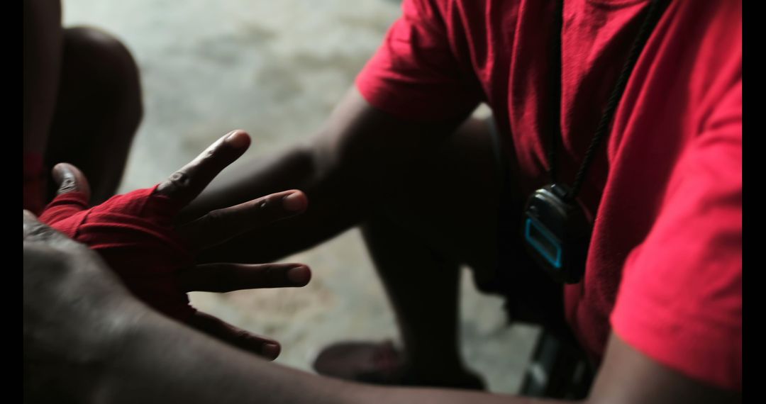 Trainer Wrapping Hand of Boxer for Training Session