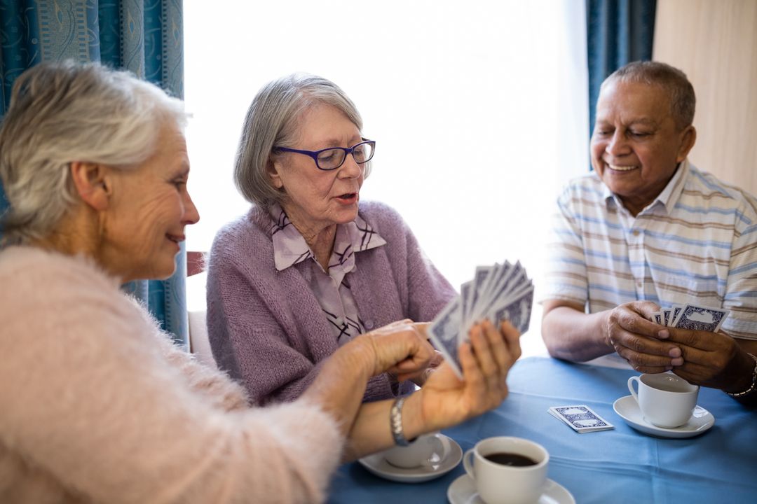Seniors Enjoying Card Game in Nursing Home - Free Images, Stock Photos and Pictures on Pikwizard.com