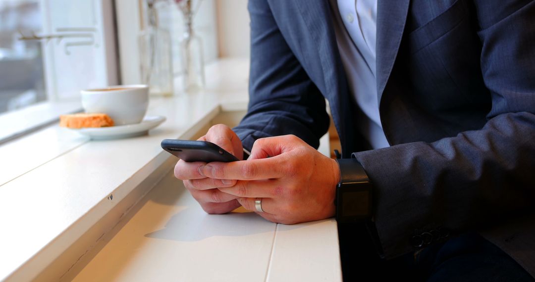 Businessman Using Smartphone in Coffee Shop - Free Images, Stock Photos and Pictures on Pikwizard.com