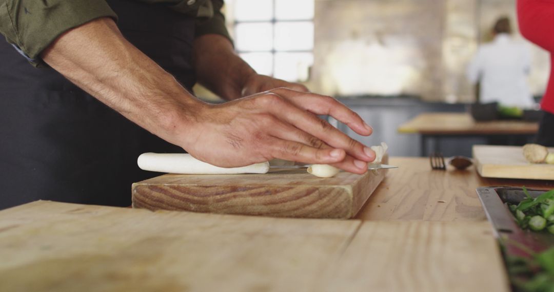 Close-up of Chef Hands Rolling Dough on Wooden Board in Kitchen - Free Images, Stock Photos and Pictures on Pikwizard.com