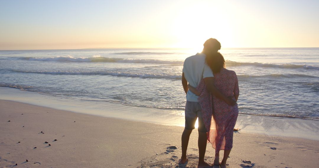Romantic Couple Embracing on Seaside at Sunset