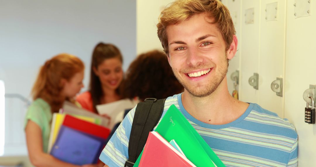 Smiling Student in Casual Attire Holding Books at University
