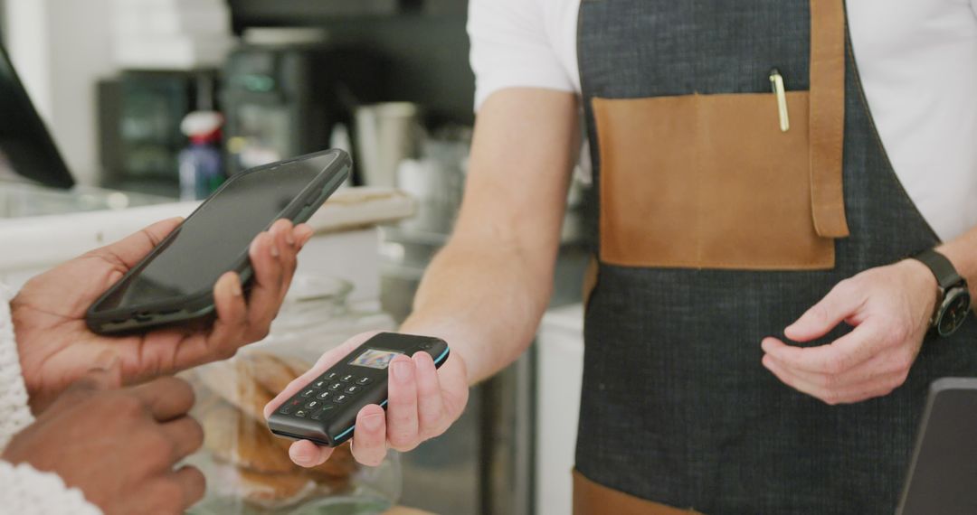 Customer Making Contactless Payment with Smartphone - Free Images, Stock Photos and Pictures on Pikwizard.com