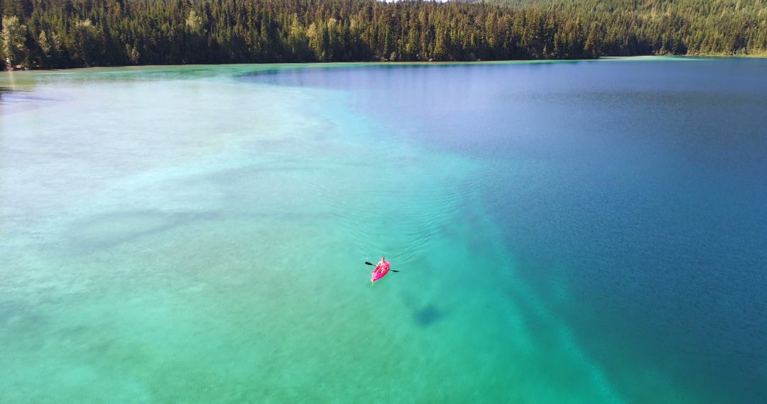 Solo Kayaking on Pristine Lake in Lush Forest - Free Images, Stock Photos and Pictures on Pikwizard.com