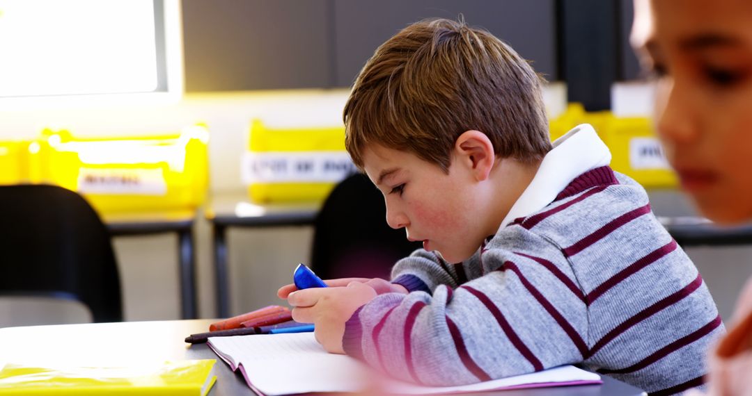 Schoolboy Focused on Mobile Phone During Class Time