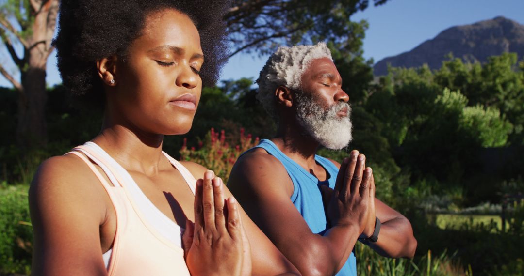 African American Man and Woman Meditating Outdoors - Free Images, Stock Photos and Pictures on Pikwizard.com