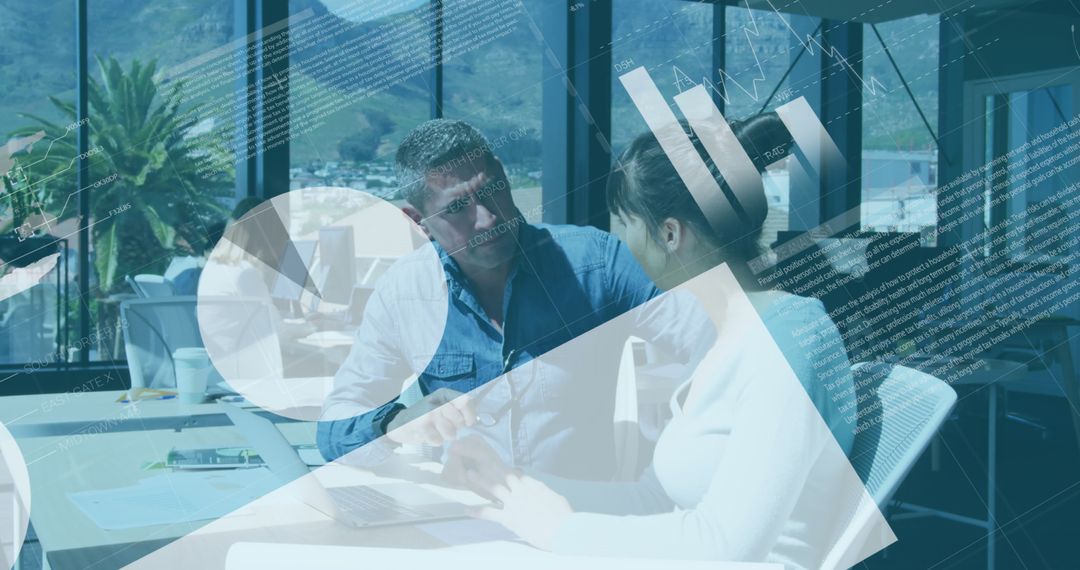 Colleagues Analyzing Data on Laptop in Modern Office Environment