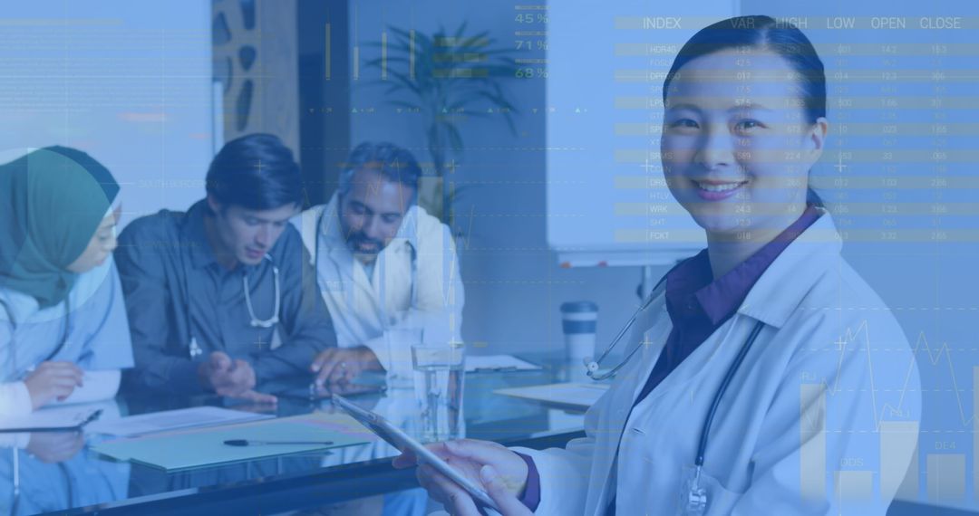 Woman Doctor Using Tablet with Diverse Medical Team in Discussion