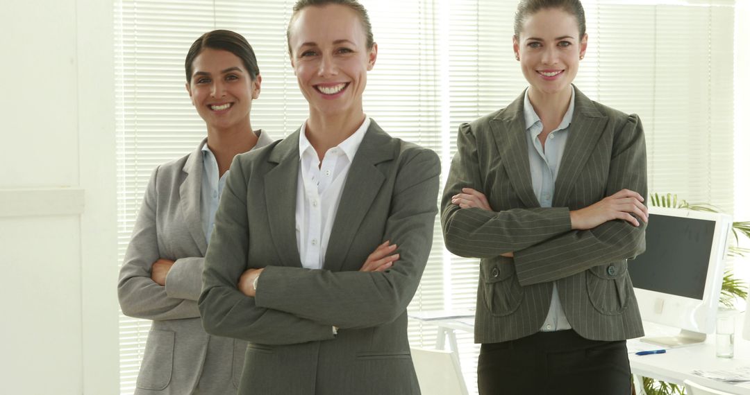 Confident Businesswomen in Suits Smiling in Office - Free Images, Stock Photos and Pictures on Pikwizard.com