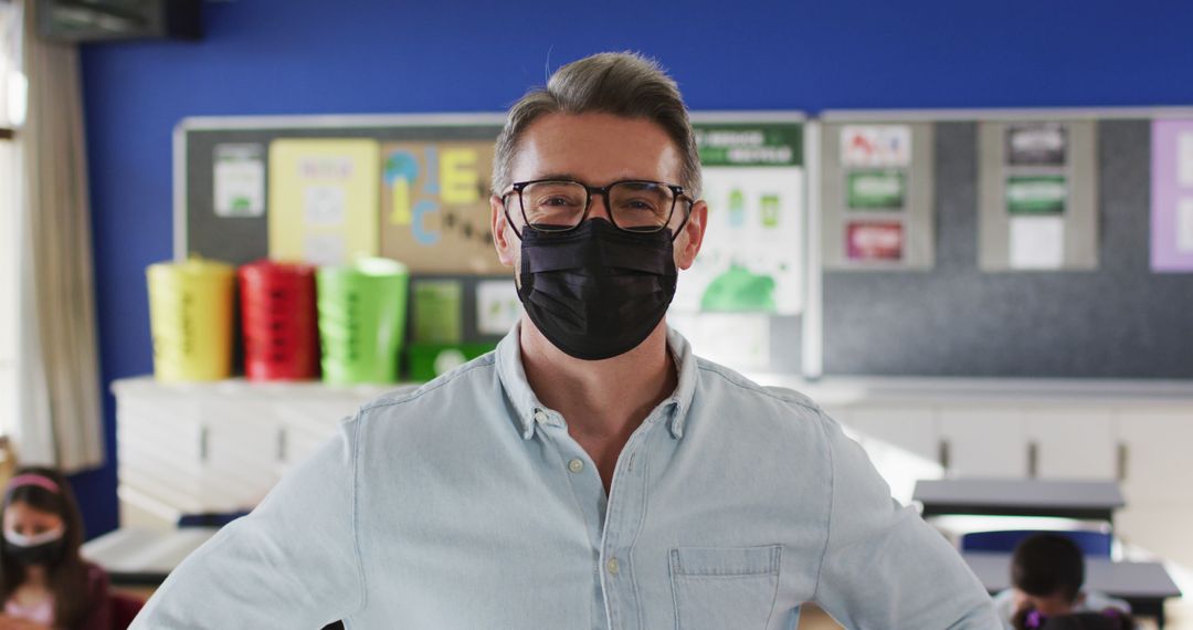 Portrait of caucasian male teacher wearing face mask in the class at school - Free Images, Stock Photos and Pictures on Pikwizard.com