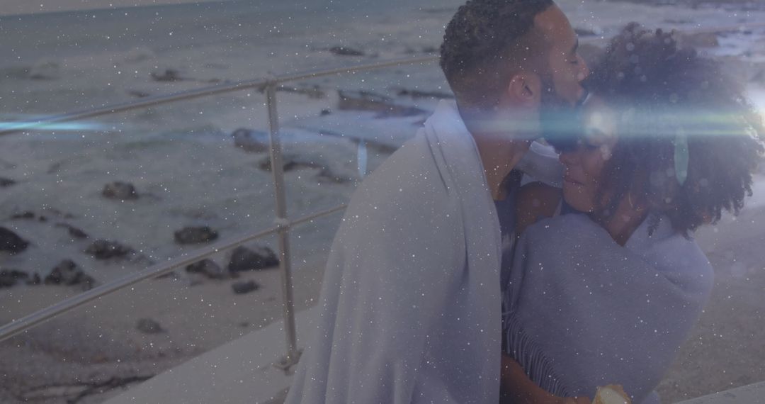 Romantic Couple Embracing on Coastal Promenade at Dusk