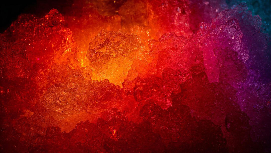 Glowing amber magenta teal crystals under dramatic backlight macro background texture