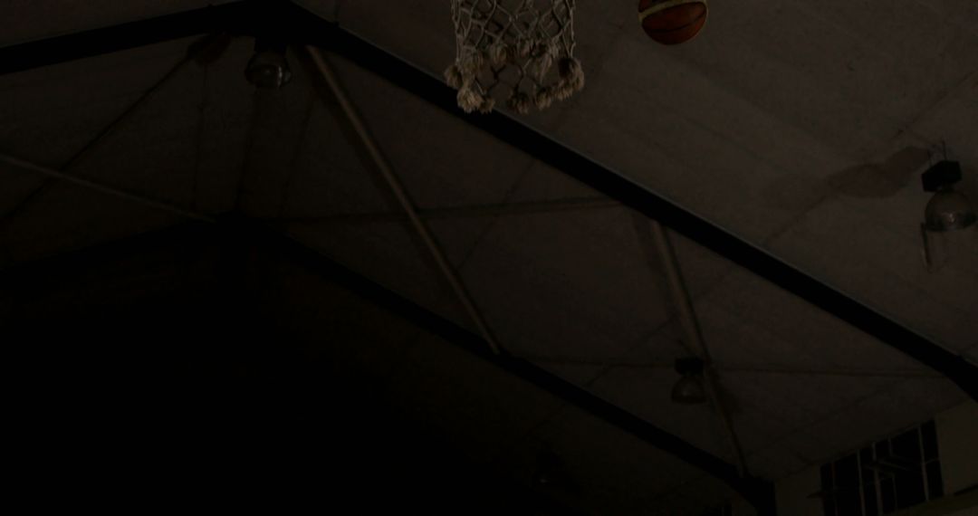 Basketball Player in Action with Dark Background
