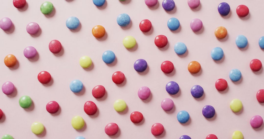 Colorful Candy Dots on Pink Background in Diagonal Pattern - Free Images, Stock Photos and Pictures on Pikwizard.com