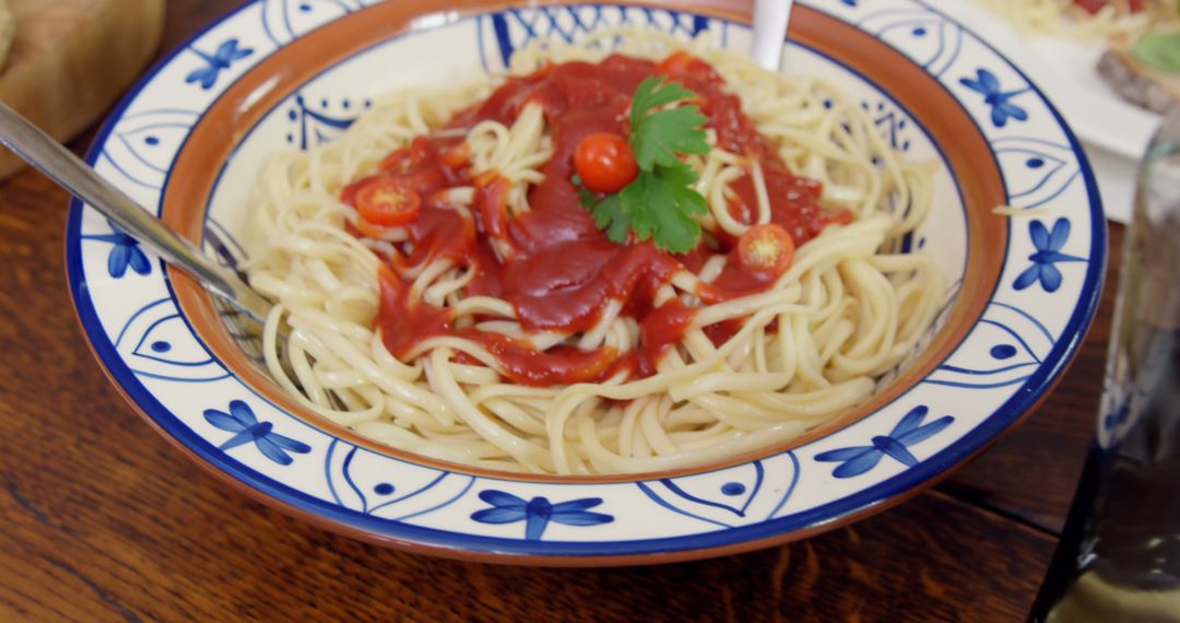 Pasta with Tomato Sauce and Garnish in Decorative Bowl - Free Images, Stock Photos and Pictures on Pikwizard.com