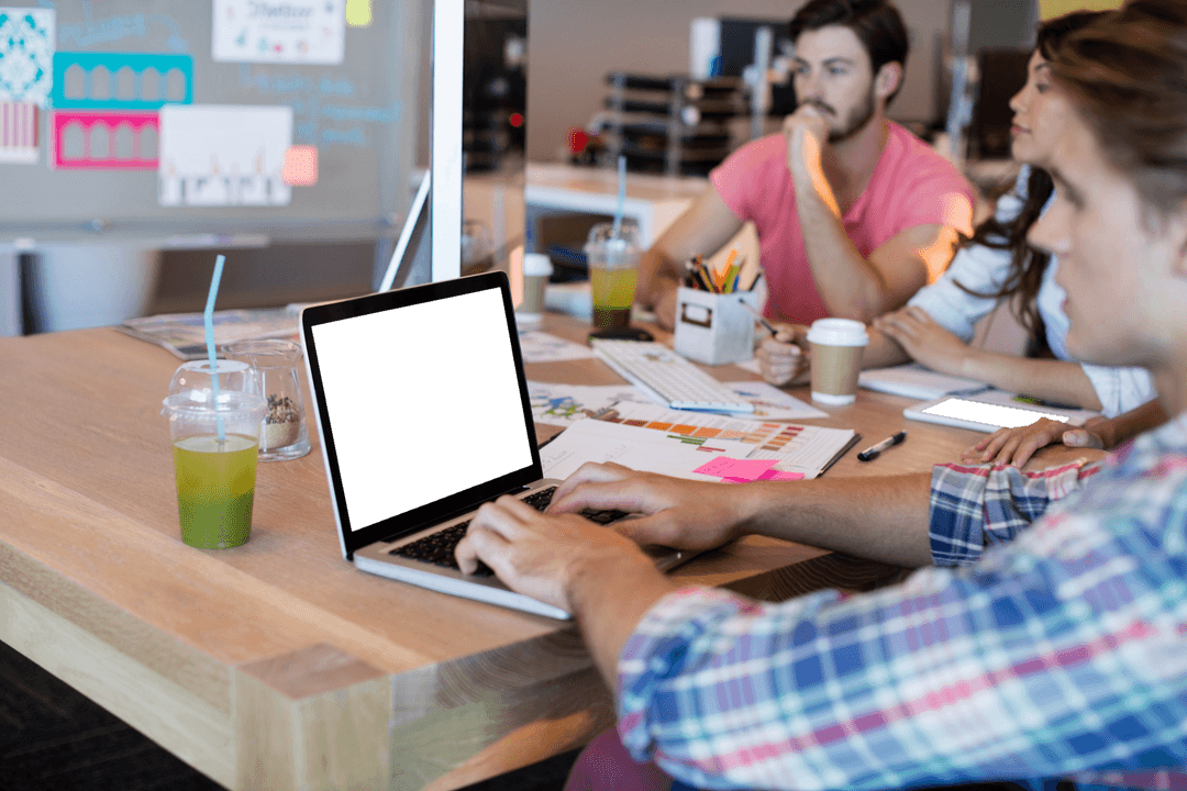Transparent Team Collaboration with Laptop and Drinks in Modern Office