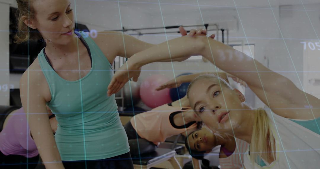 Group Pilates Class Regaining Flexibility in Modern Studio