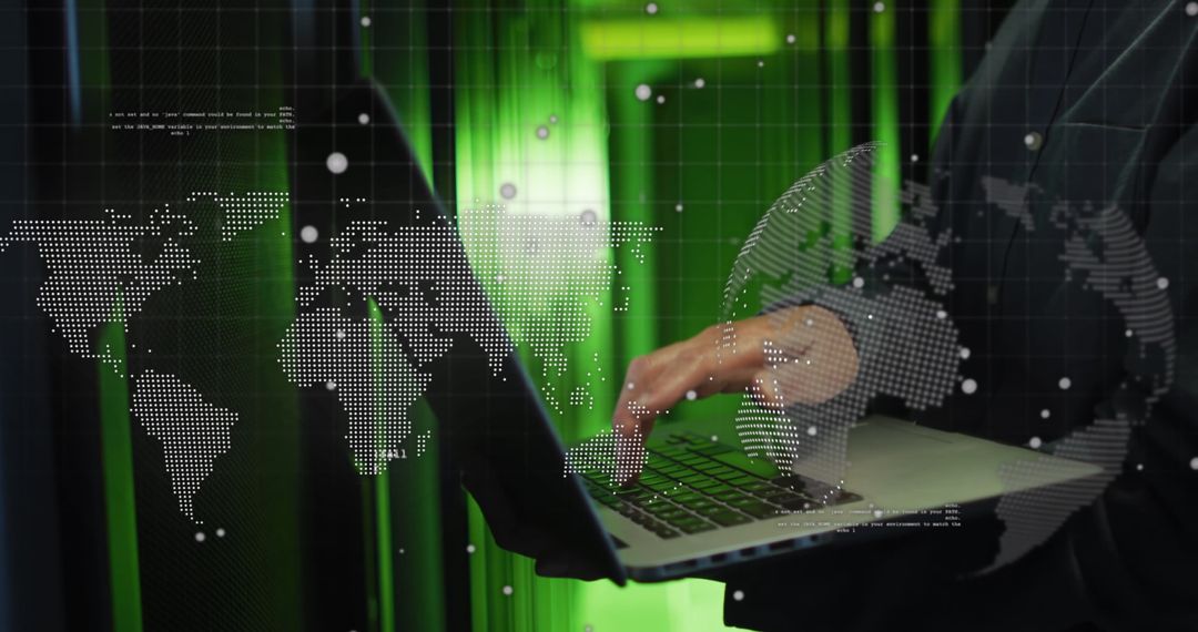 IT Technician Using Laptop for Global Data Processing