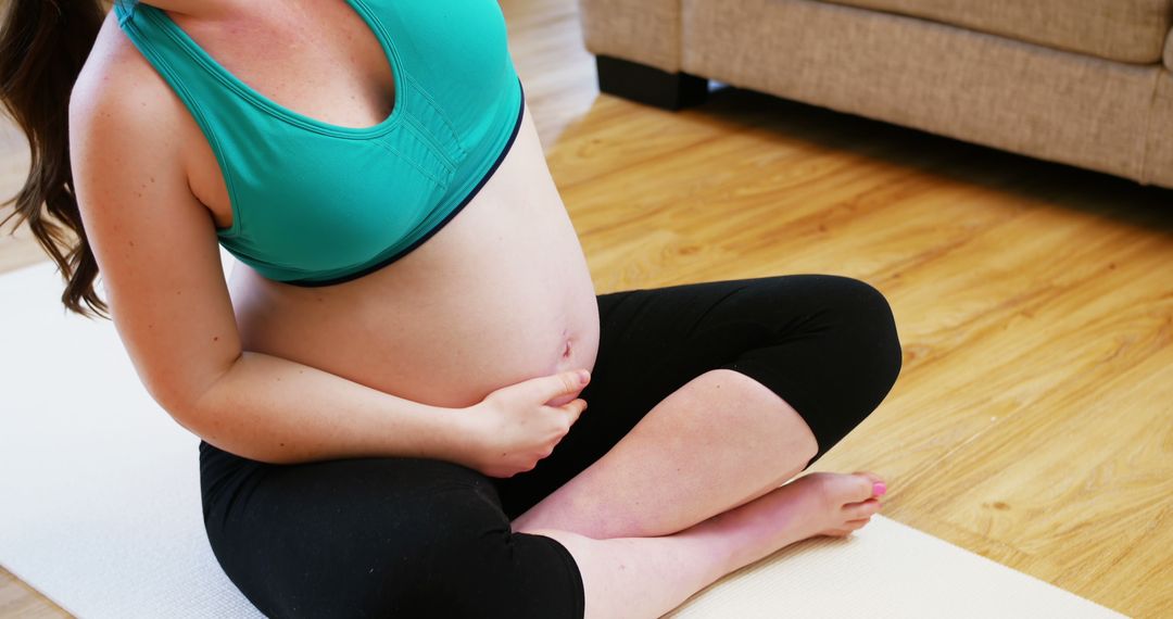 Pregnant Woman Practicing Yoga on Mat at Home - Free Images, Stock Photos and Pictures on Pikwizard.com