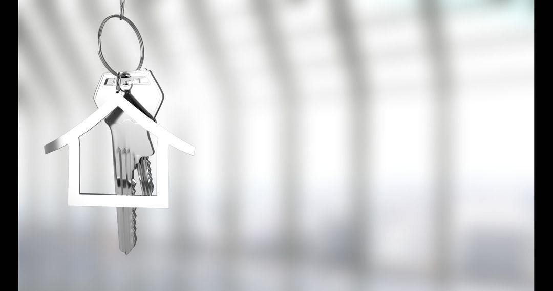 House-Shaped Metallic Keychain with Keys in Modern Interior
