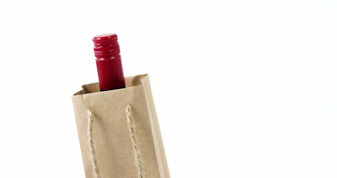 Wine Bottle in Brown Paper Bag on White Background - Free Images, Stock Photos and Pictures on Pikwizard.com