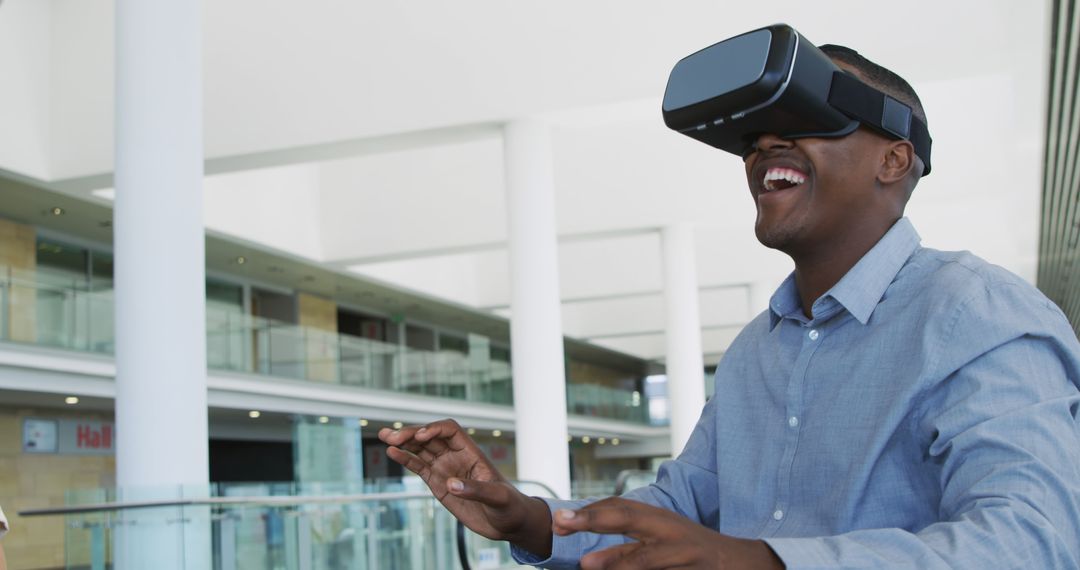 Engaged Man Enjoying Virtual Reality Experience in Modern Building - Free Images, Stock Photos and Pictures on Pikwizard.com