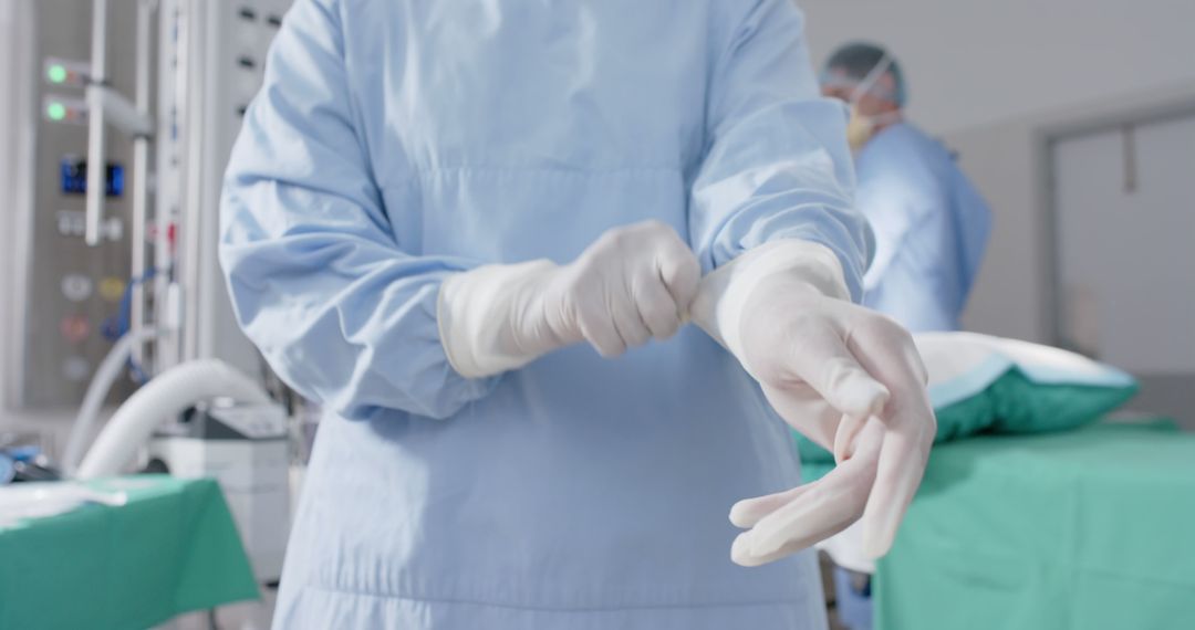 Surgeon Putting on Sterile Gloves in Operating Room - Free Images, Stock Photos and Pictures on Pikwizard.com