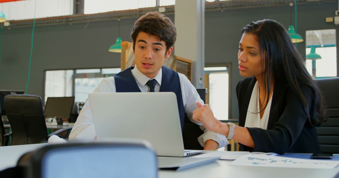 Young Native American Man and Biracial Woman Collaborating on Work Project in Modern Office - Free Images, Stock Photos and Pictures on Pikwizard.com