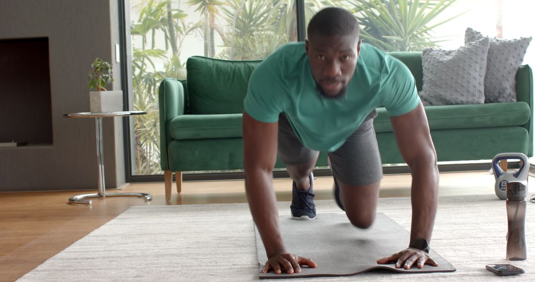 Focused Man Executing Plank Exercise in Modern Living Room