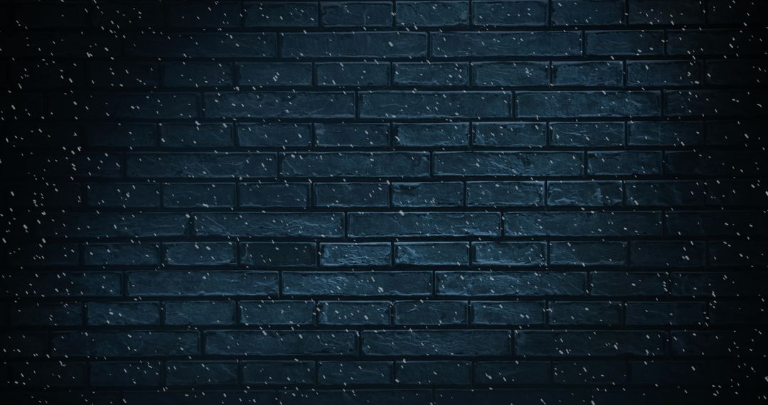 Snow Falling Against Dark Brick Wall Background
