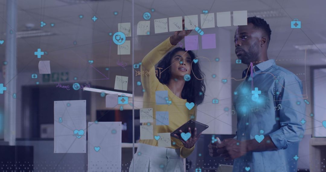 Diverse Colleagues Brainstorming with Digital Media Interface