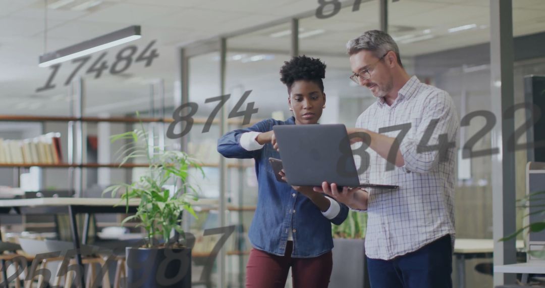 Diverse Colleagues Analyzing Data with Overlay of Numbers