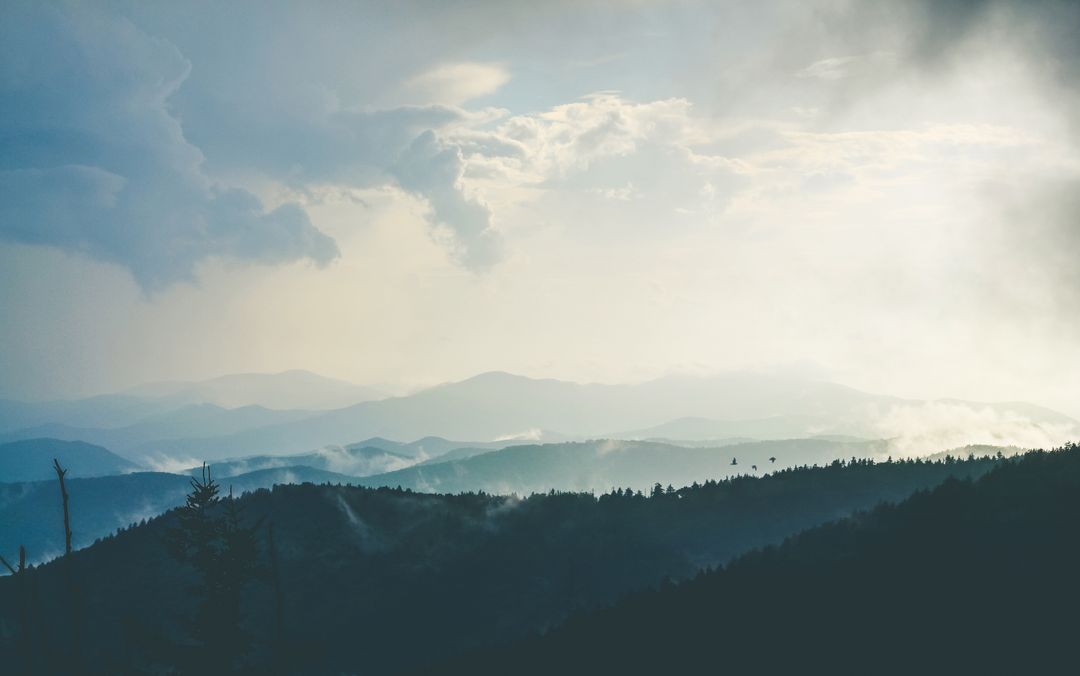 Misty Mountain Ranges Under Dramatic Sky with Dense Clouds - Free Images, Stock Photos and Pictures on Pikwizard.com