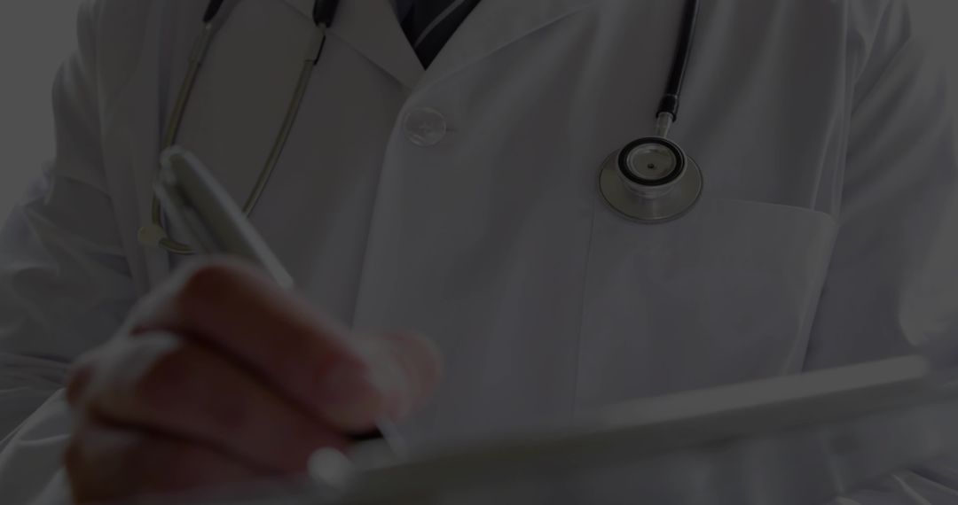 Closeup of Doctor Reviewing Patient Records with Tablet and Stylus