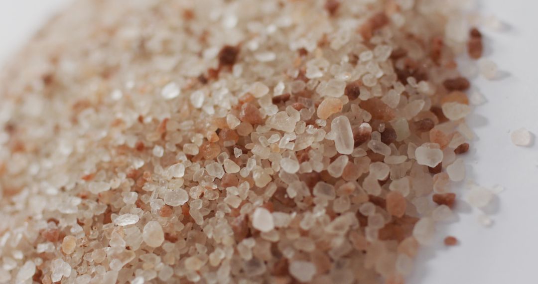 Close-up of Himalayan Pink Salt Crystals on White Surface
