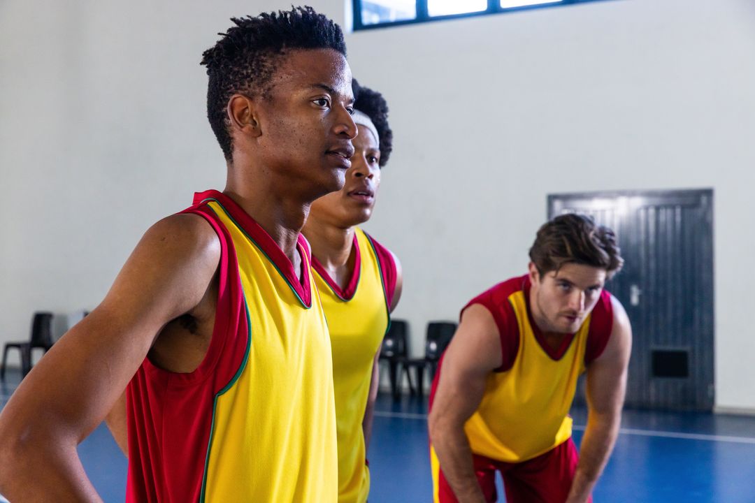 Determined Basketball Team Resting on Court